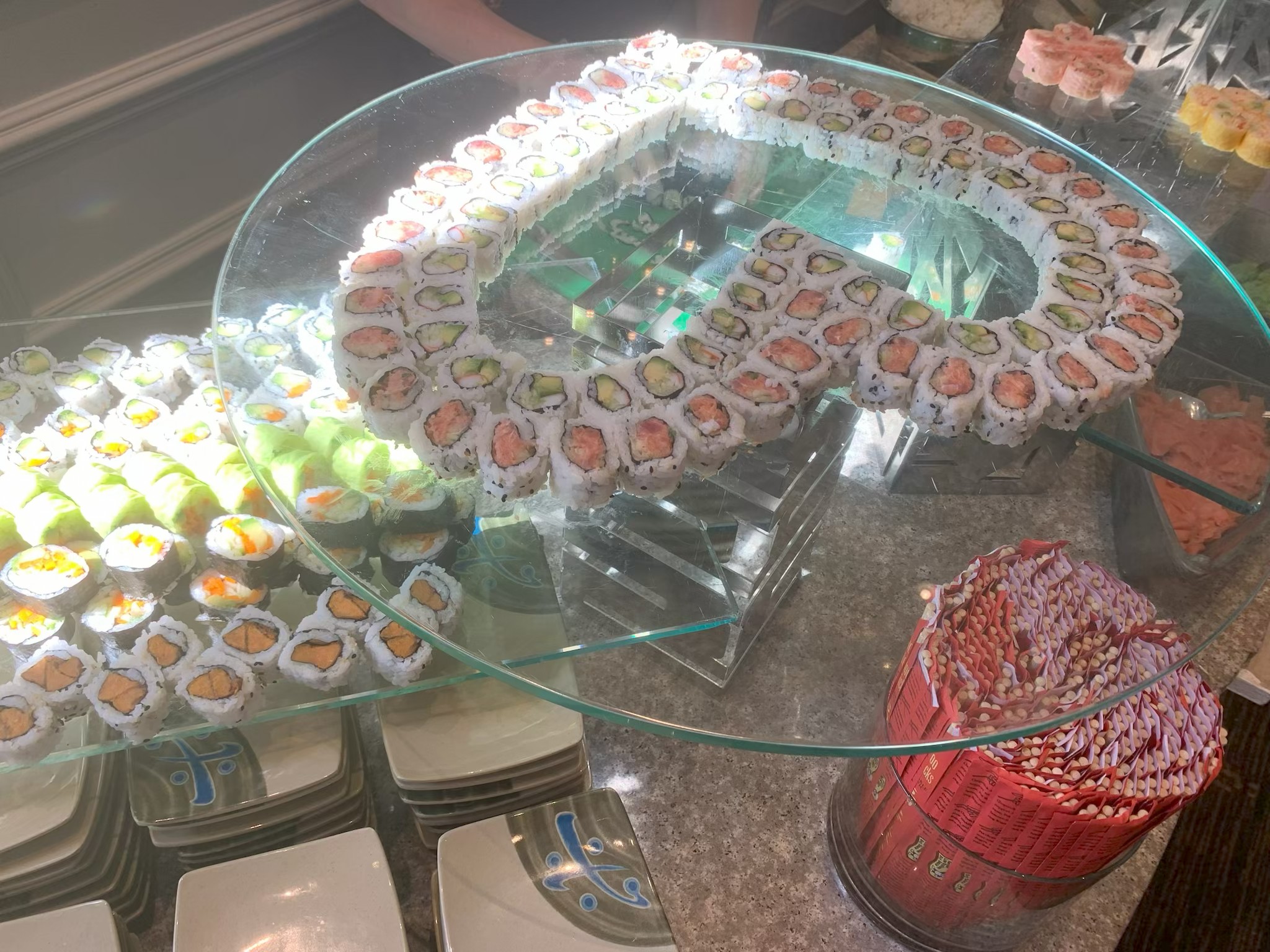 Elegant sushi boat presentation with various platters and specialty selections